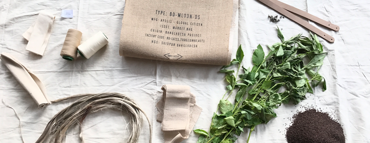 Apolis market bags and materials arranged in a scene